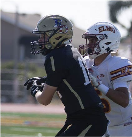 A group of football players celebrating a touchdown. Description generated by AI