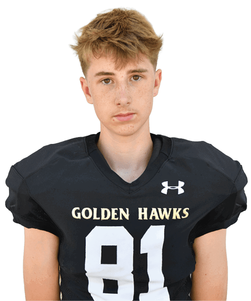 A person with short light brown hair wearing a black football jersey with the word “HAWKS" and the number 82 on the front. Description generated by AI