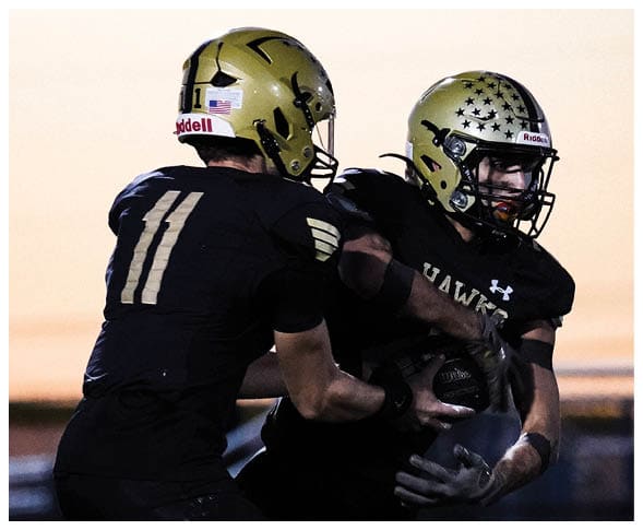 A group of football players wearing black jerseys with the number 3 on them. Description generated by AI