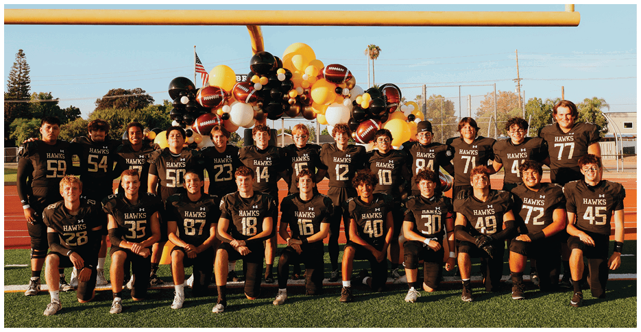Two football players wearing black jerseys with the number 11 on them. Description generated by AI