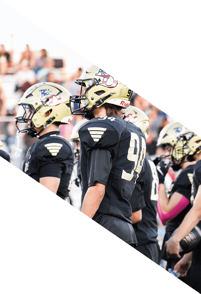 Three football players wearing green uniforms and black helmets pose for a photo. AI generated content