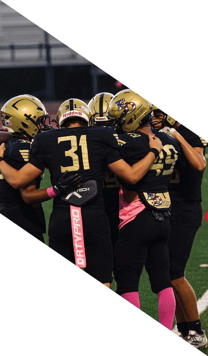 A group of people wearing black jerseys are huddled together on a field. AI generated content