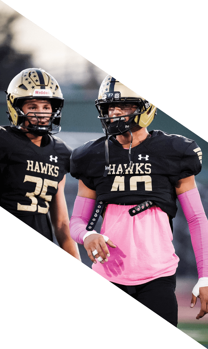 A group of football players pose for a picture. AI generated content