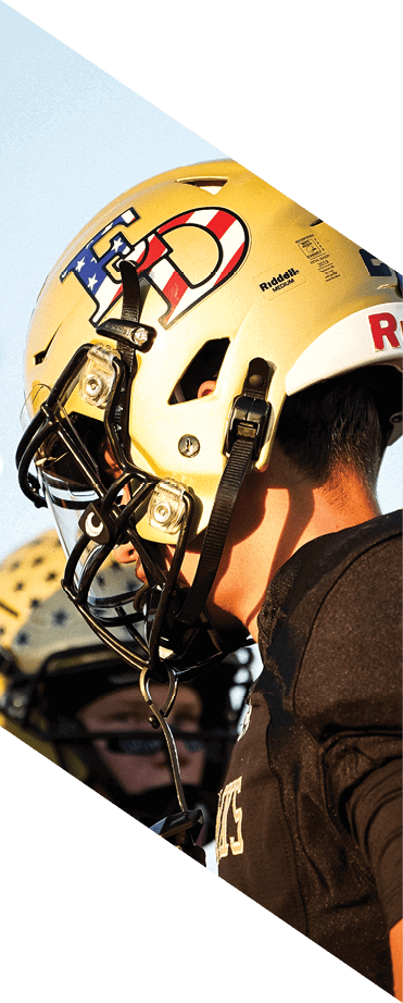 A football player wearing a helmet and white uniform is holding his helmet above his head. AI generated content