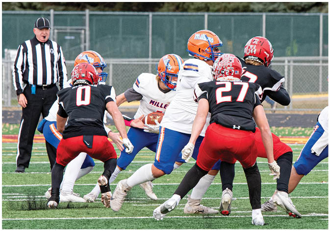 A group of football players wearing black and white uniforms. Description generated by AI