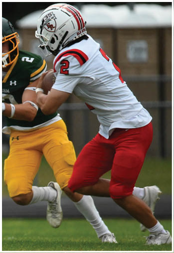 A group of football players celebrating a touchdown. Description generated by AI