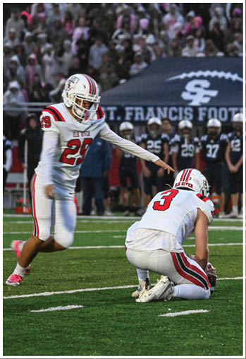 A group of football players celebrating a touchdown. Description generated by AI