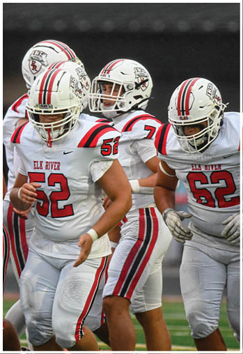 A group of football players celebrating a touchdown. Description generated by AI