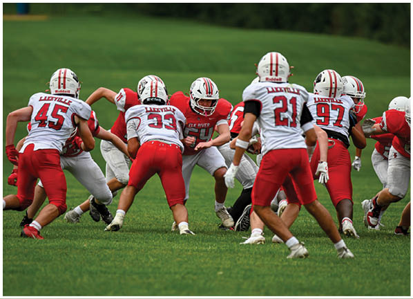 A football player running on the field. Description generated by AI