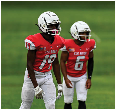 A football player running on the field. Description generated by AI