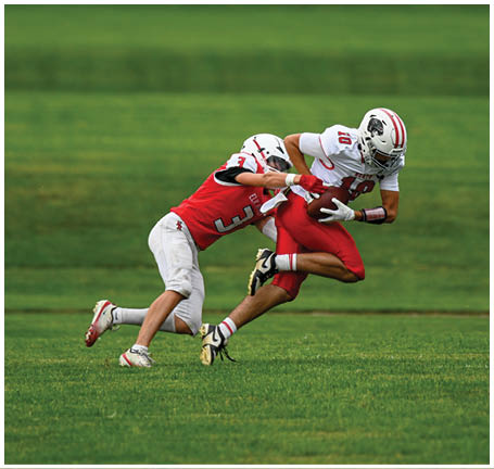 A football player running on the field. Description generated by AI