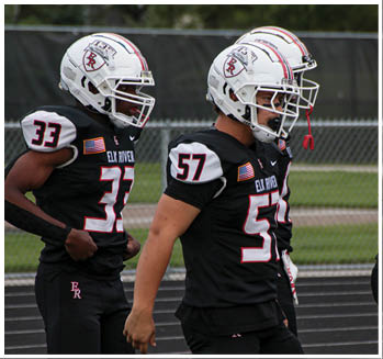 A group of football players celebrating a touchdown. Description generated by AI