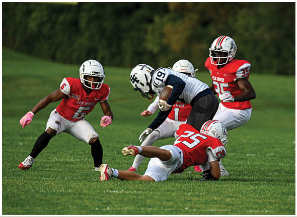 A football player running on the field. Description generated by AI