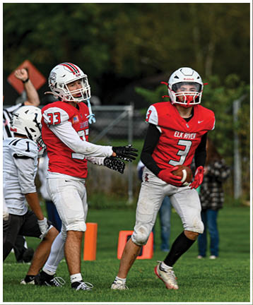 A football player running on the field. Description generated by AI