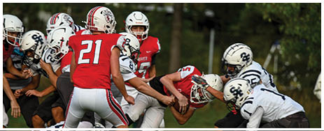 A football player running on the field. Description generated by AI