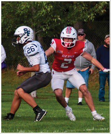 A football player running on the field. Description generated by AI