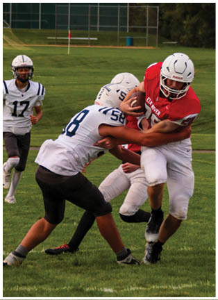 A football player running on the field. Description generated by AI