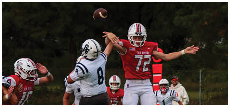 A football player running on the field. Description generated by AI