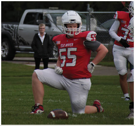A football player running on the field. Description generated by AI