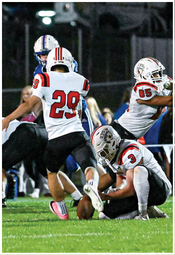 A group of football players celebrating a touchdown. Description generated by AI