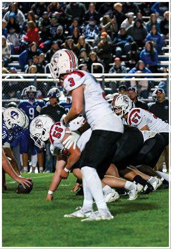 A group of football players celebrating a touchdown. Description generated by AI
