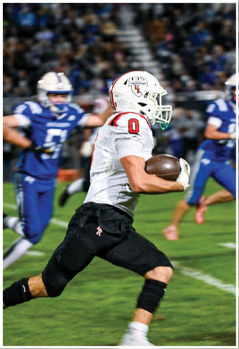 A group of football players celebrating a touchdown. Description generated by AI