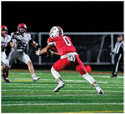 A group of football players celebrating a touchdown. Description generated by AI