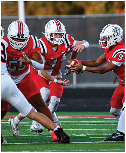 A group of football players celebrating a touchdown. Description generated by AI