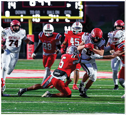 A group of football players celebrating a touchdown. Description generated by AI