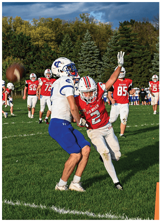 A football player running on the field. Description generated by AI
