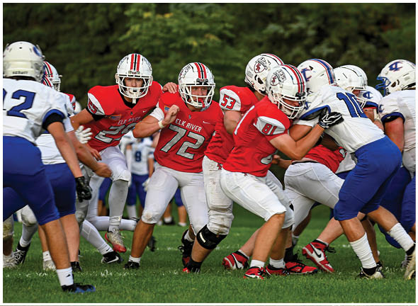 A football player running on the field. Description generated by AI
