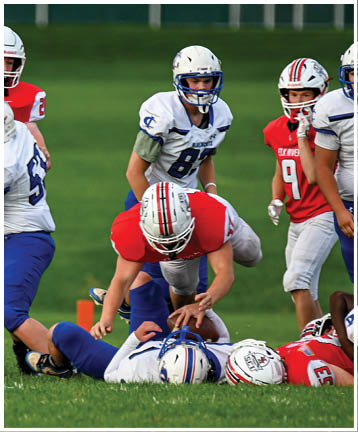 A football player running on the field. Description generated by AI
