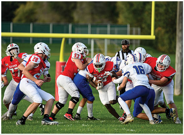 A football player running on the field. Description generated by AI
