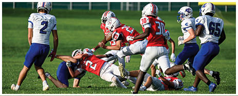 A football player running on the field. Description generated by AI