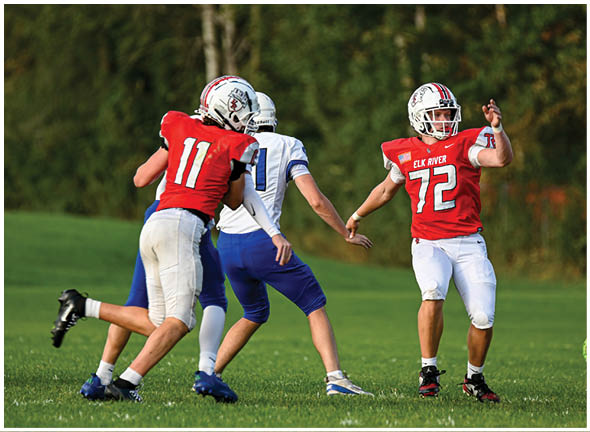 A football player running on the field. Description generated by AI