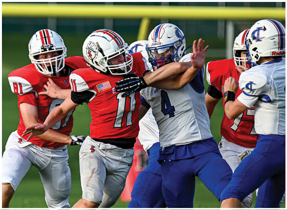 A football player running on the field. Description generated by AI