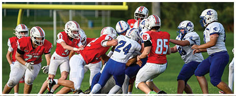 A football player running on the field. Description generated by AI