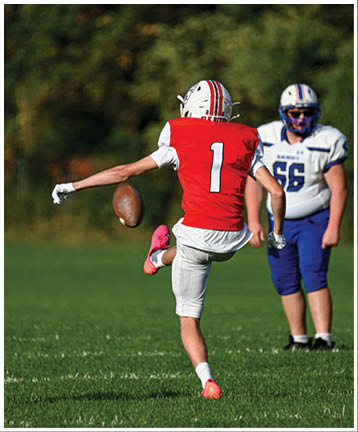 A football player running on the field. Description generated by AI