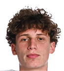Person with curly hair wearing a white football jersey with “Wildcats" written on it and shoulder pads. Description generated by AI
