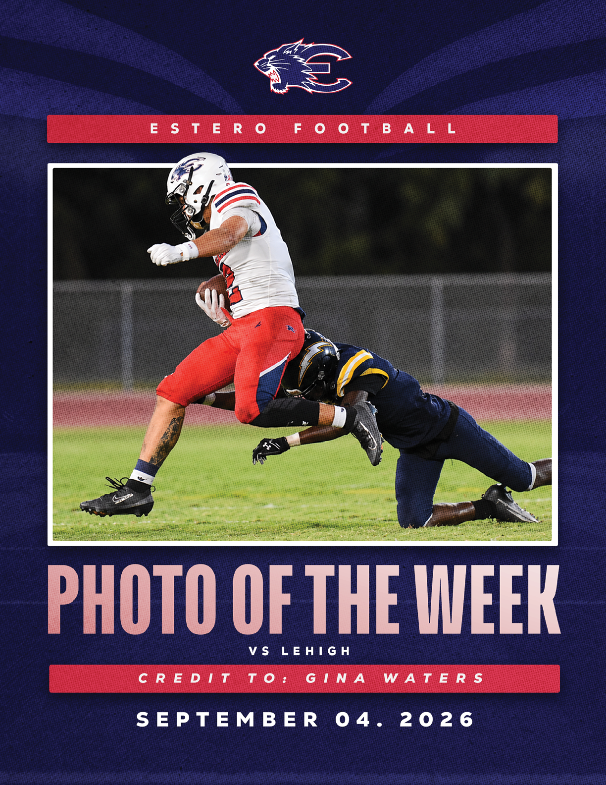 A person in red pants and a white football uniform is running while holding a football as another person in a dark blue uniform tackles them on a grassy field. Description generated by AI