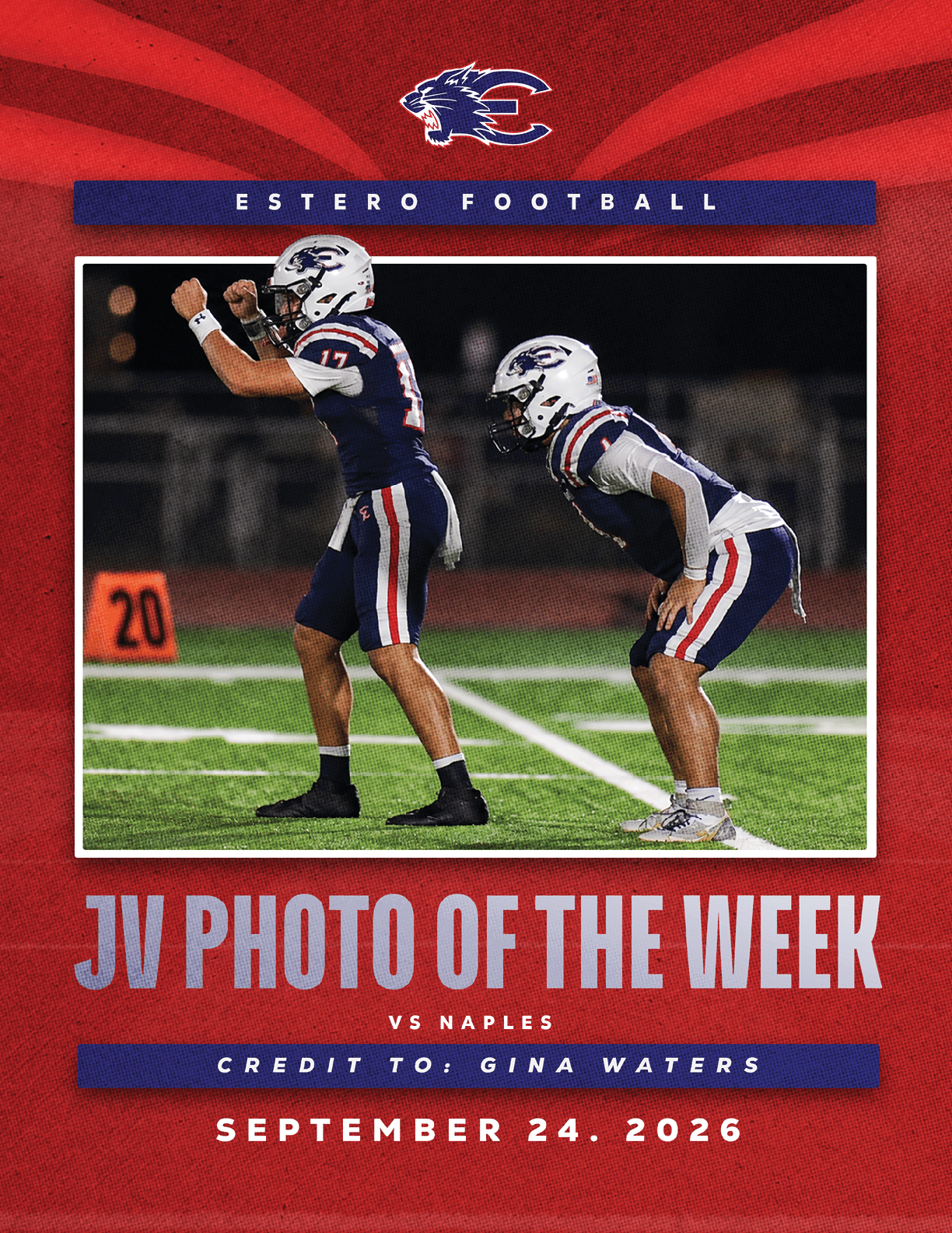 Two football players in white uniforms with helmets embrace on the field during a game. Description generated by AI
