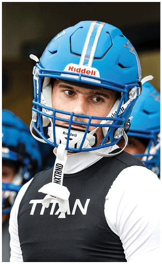A football player catching a ball. Description generated by AI