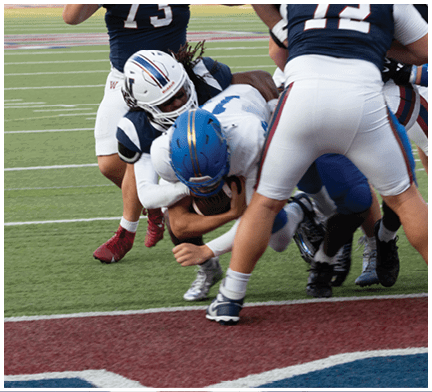 A football player running on the field. Description generated by AI