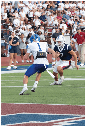 A football player running on the field. Description generated by AI