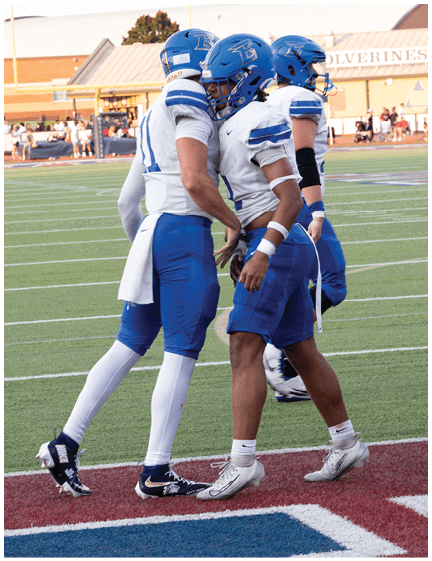 A football player wearing a blue jersey with the number 58 on it. Description generated by AI