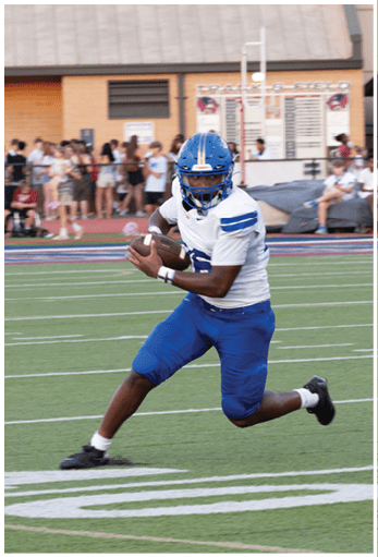 A football player running on the field. Description generated by AI