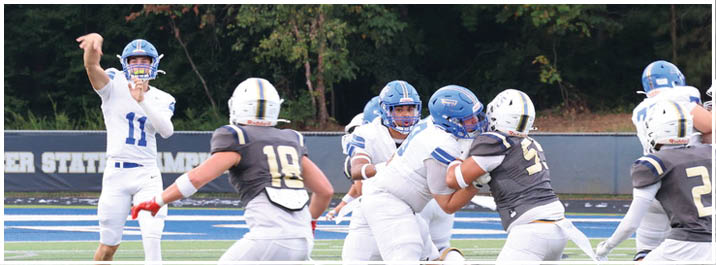 A football player is sliding on the ground. Description generated by AI