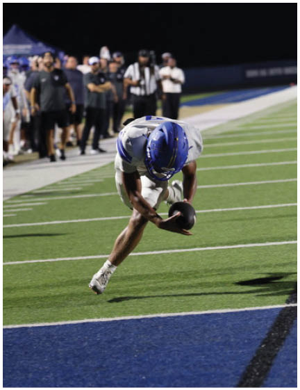 A football player wearing a blue jersey with the number 58 on it. Description generated by AI