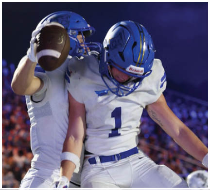 A football player running on the field. Description generated by AI