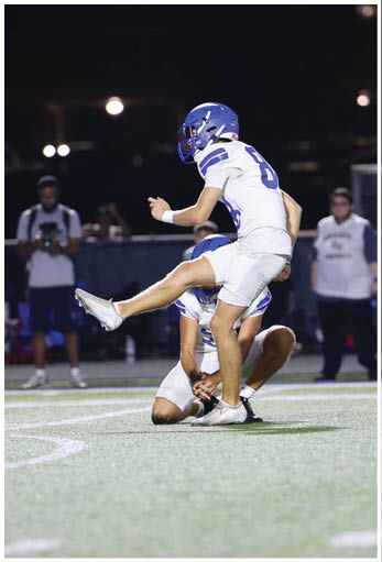 A football player running on the field. Description generated by AI